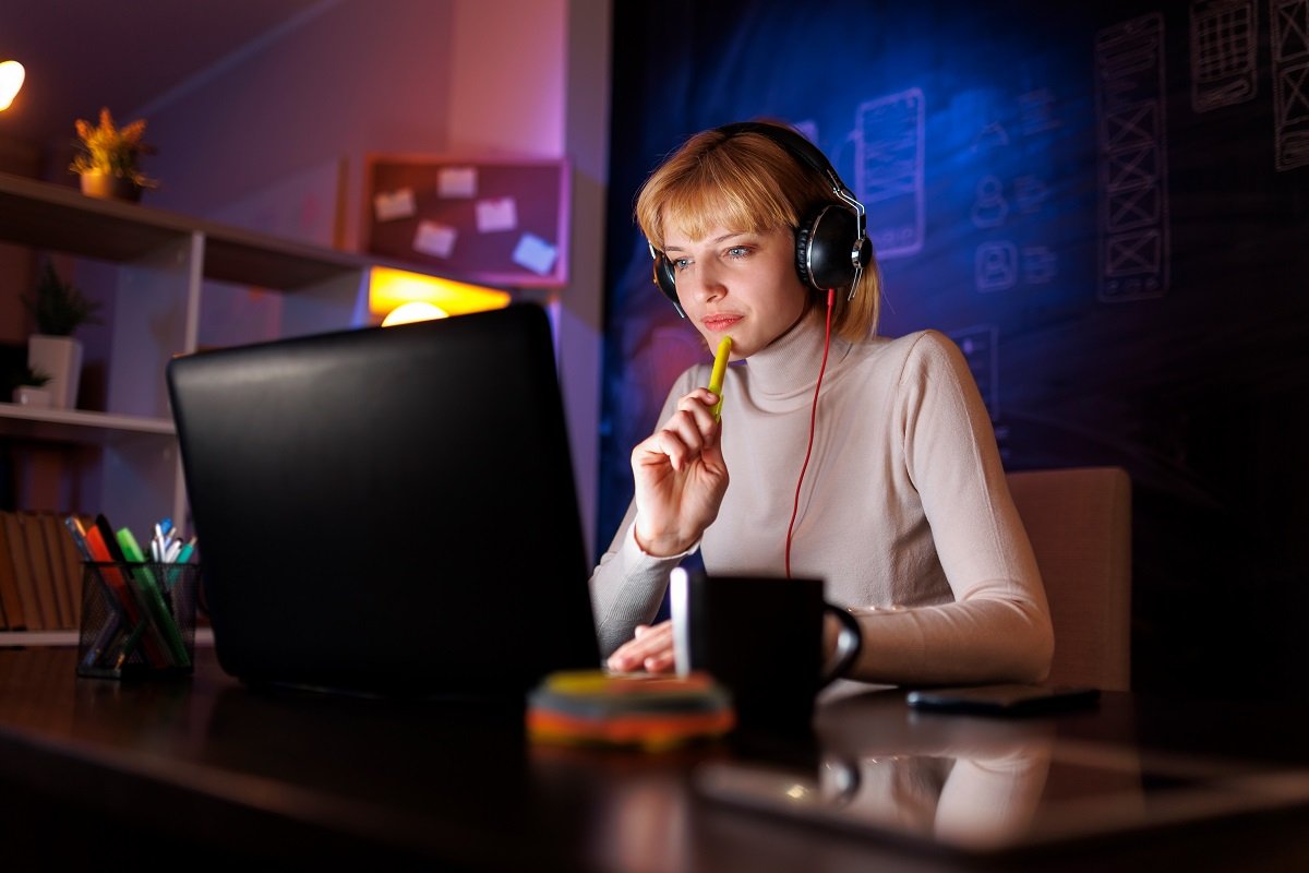 A woman working at a computer.